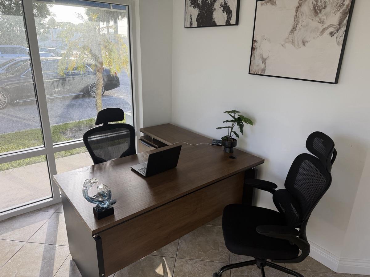 Private office with a desk and seating for visitors